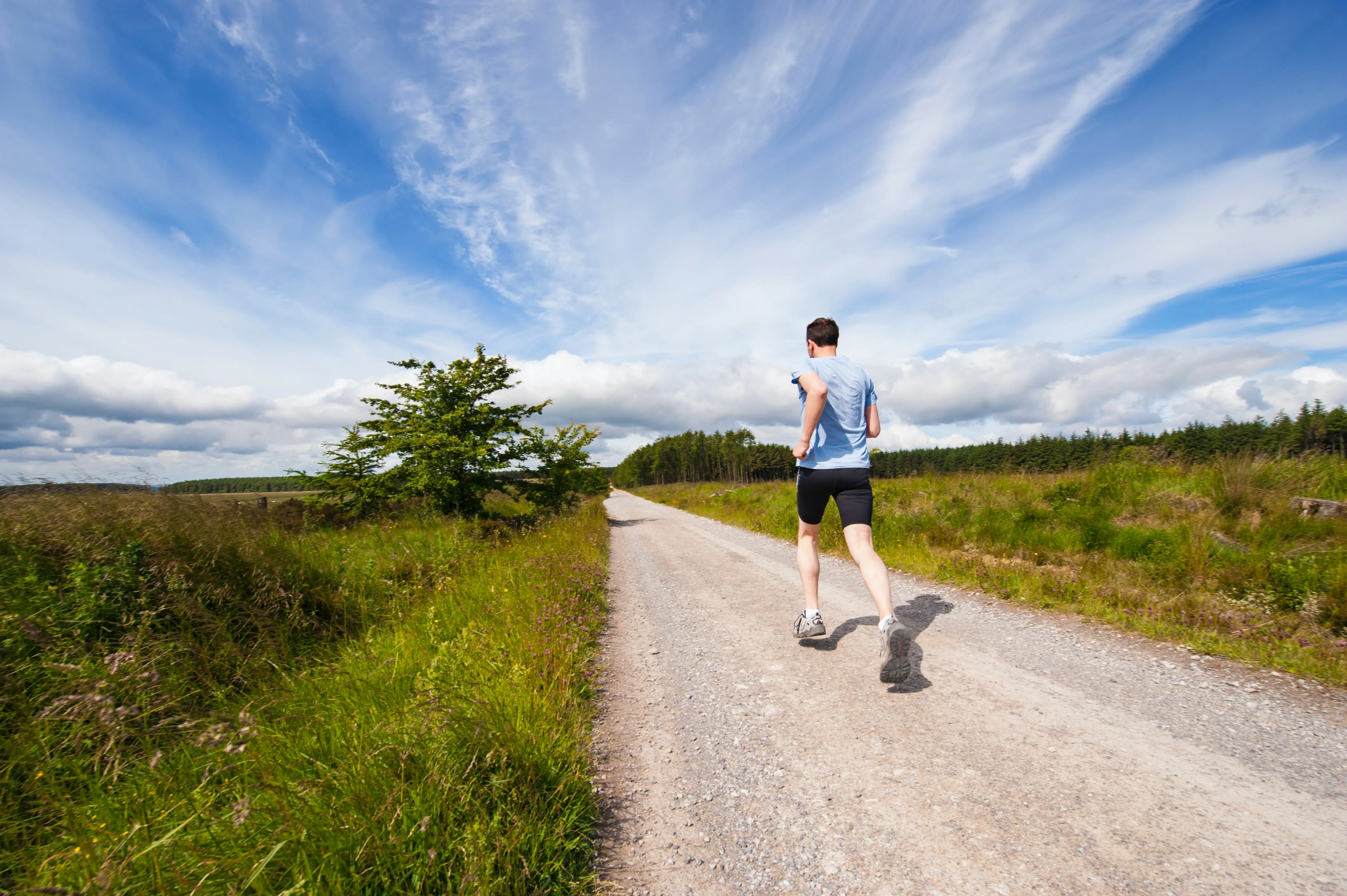 Man Running on Mountain Trail